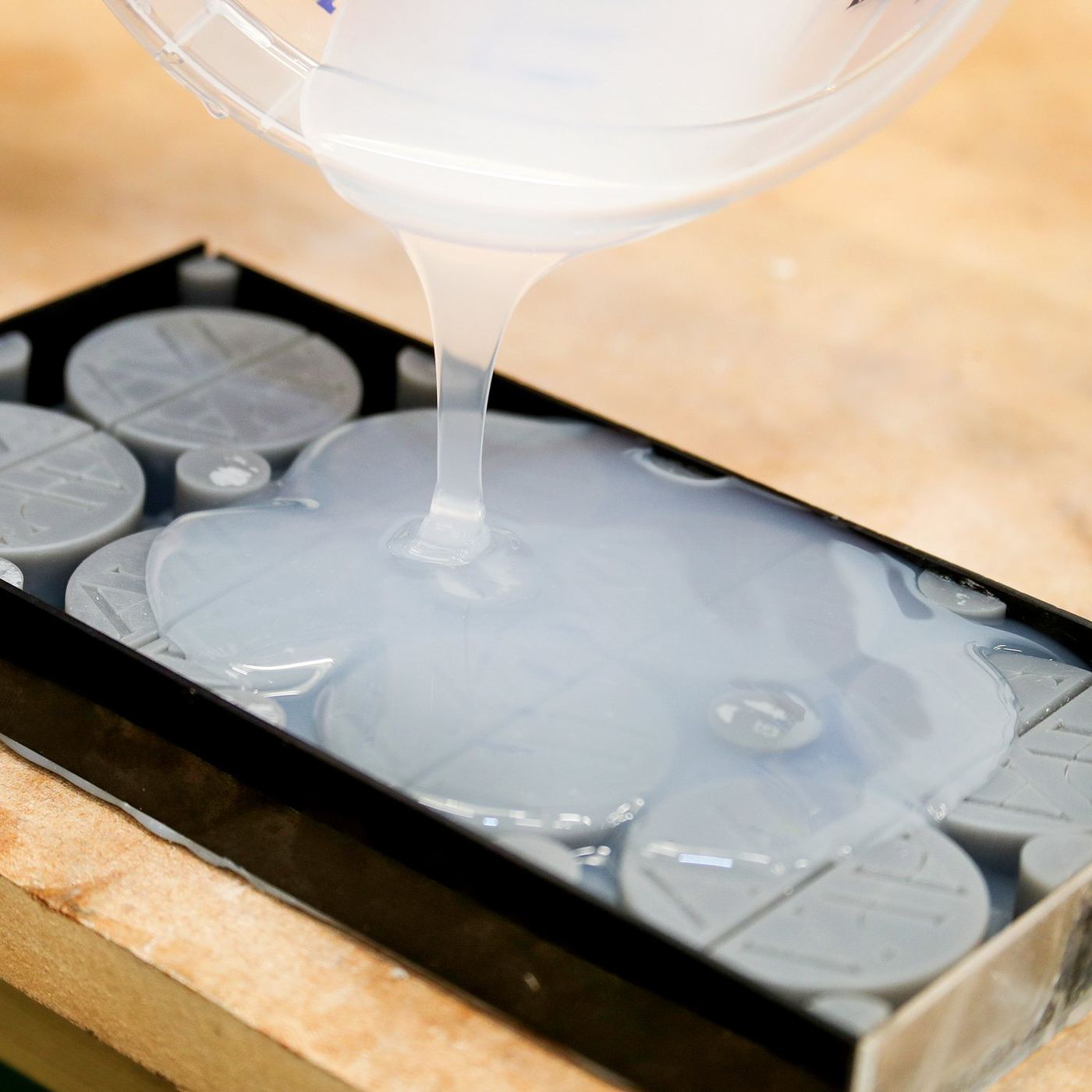 Pouring silicone over master patterns at TCI
